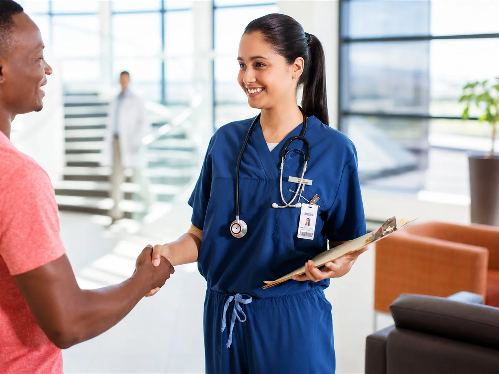 Clinician greeting a patient at an independent hormone and longevity clinic