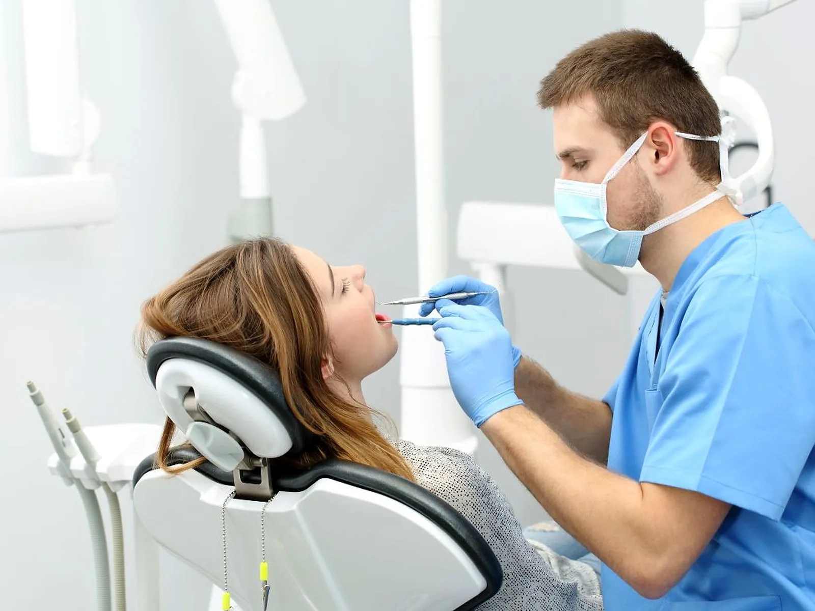 Dentist treating a patient in the chair