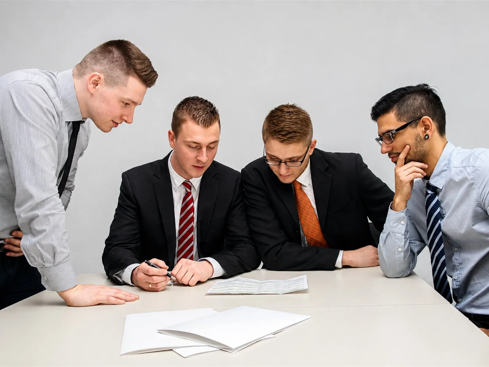 Insurance agents reviewing policy documents