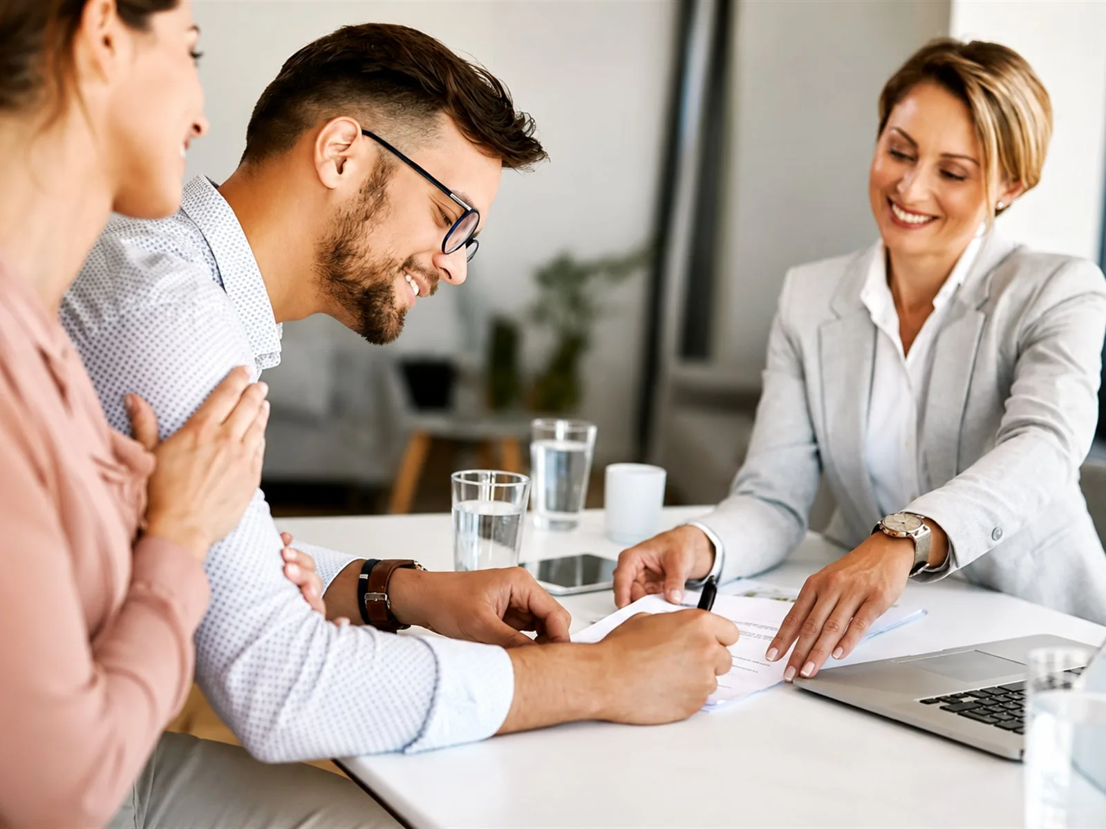 Mortgage broker meeting clients about a loan